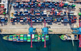 Aerial view of containers in harbour.